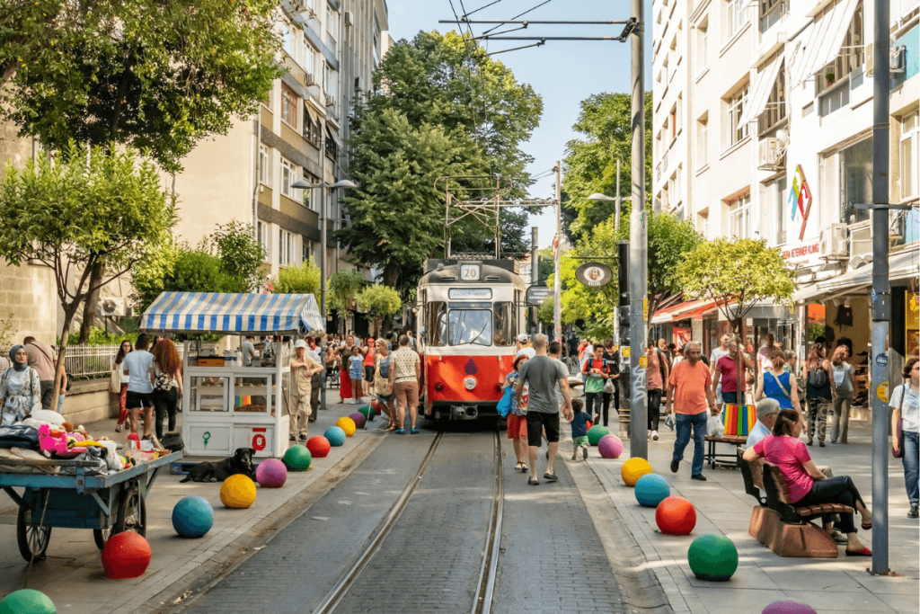 A vibrant scene of Istanbul's bustling streets, filled with people exploring the city's rich cultural heritage and lively atmosphere.