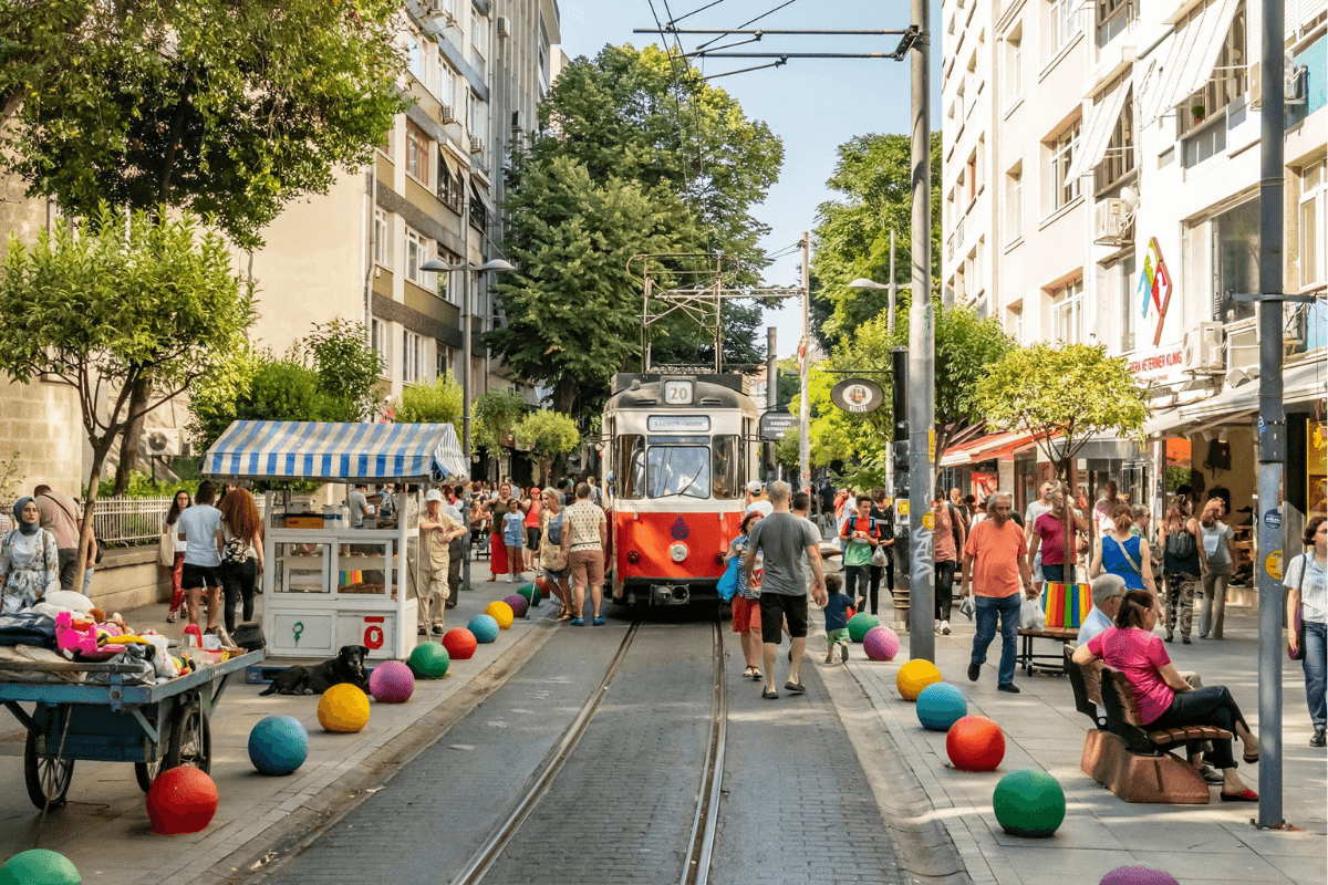 A vibrant scene of istanbul's bustling streets, filled with people exploring the city's rich cultural heritage and lively atmosphere.
