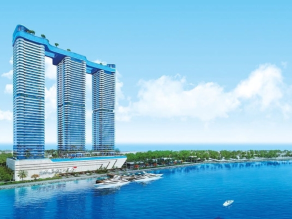 Exterior view of oceanz by danube apartments in dubai maritime city featuring luxury seafront architecture.