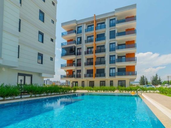 Family apartments for sale in antalya kepez near tram with swimming pool parking playground and spacious interiors