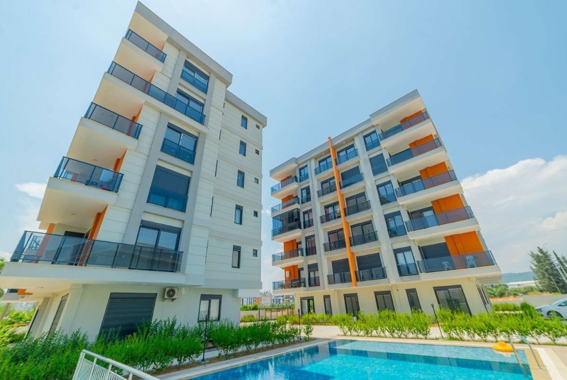 family apartments for sale in Antalya Kepez near tram with swimming pool parking playground and spacious interiors
