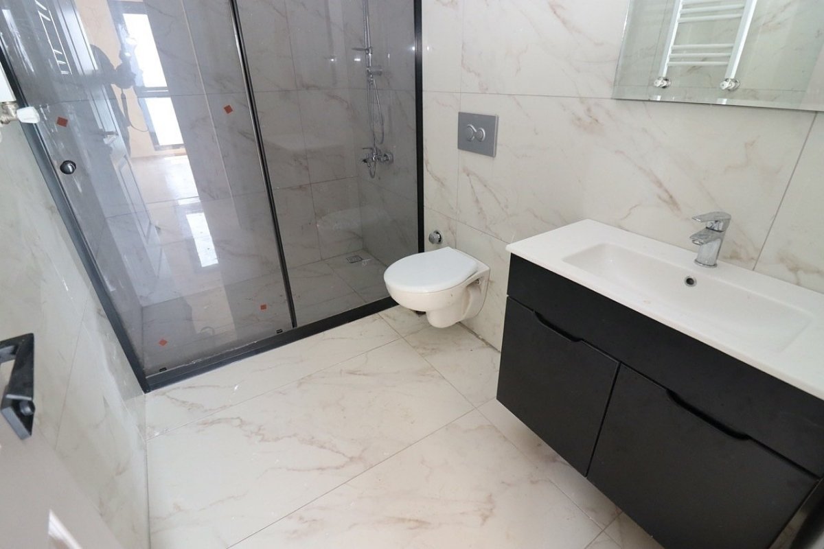 sea view apartments for sale in Mersin Mezitli near the beach with communal pool and ready to move interiors